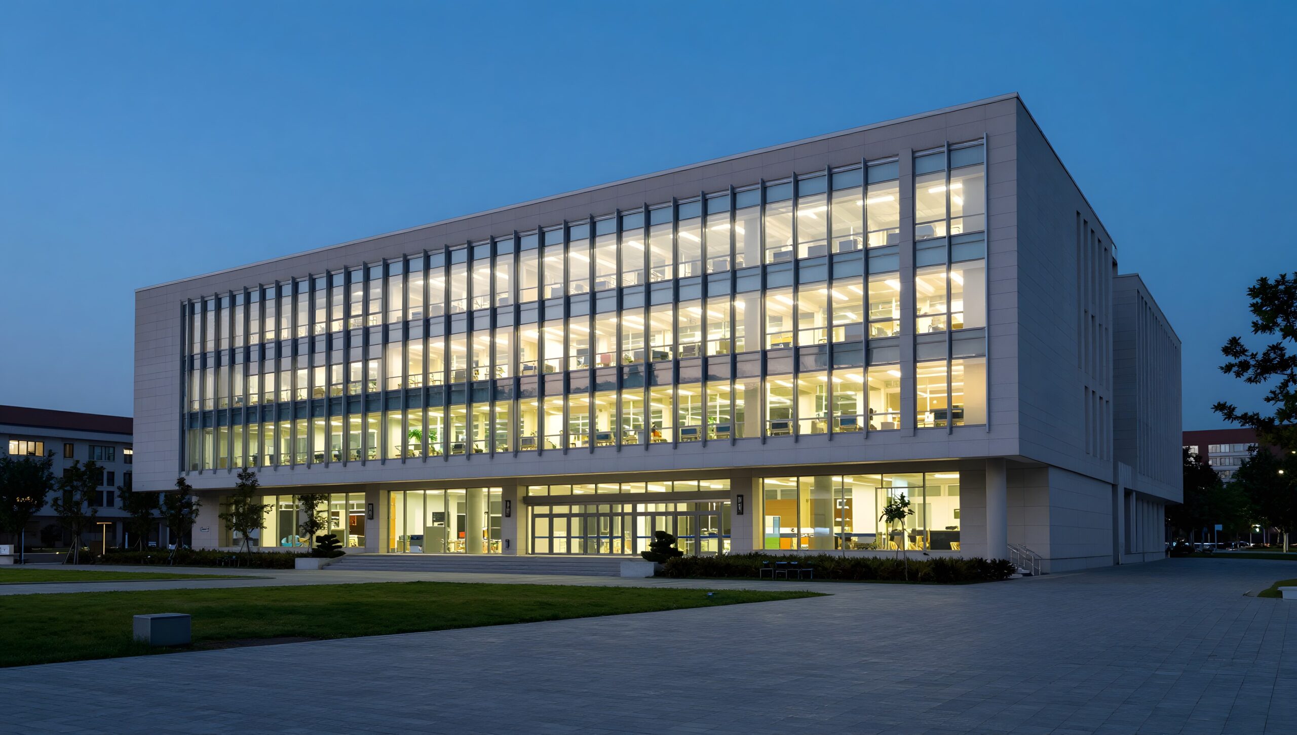 Modern university research building at dusk