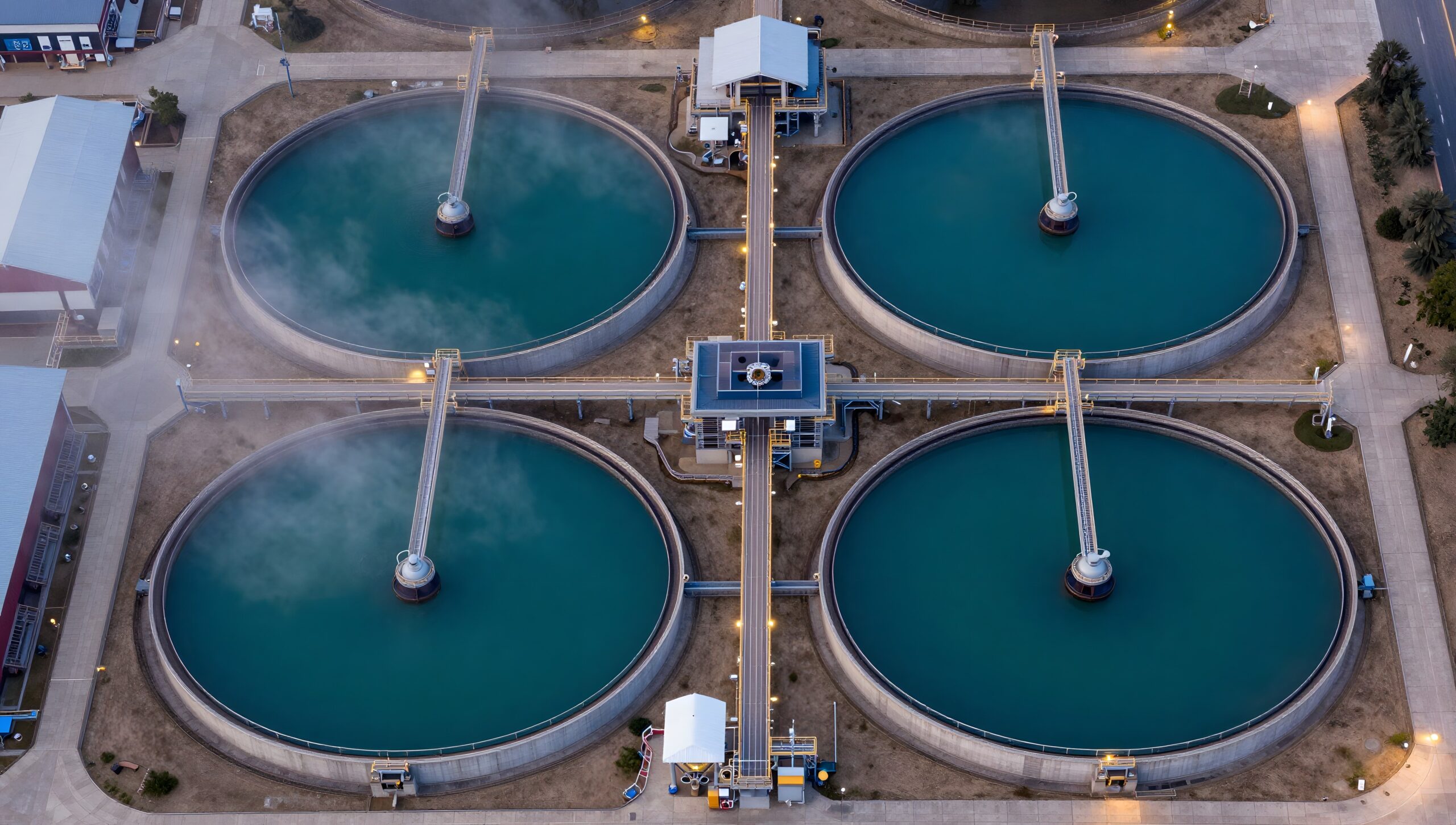 Aerial view of circular clarifiers at an industrial water treatment plant